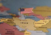 Rubio Rushes To Calm Furious Gulf A map highlighting Iran with a small American flag pin