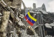 Rescue workers search a collapsed building site