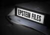 What Is Missing From Epstein Files? A black binder labeled 'Epstein Files' with papers and a pen beside it