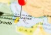 Gulf Night Erupts — What Really Hit Bahrain? Map of Qatar with a red pin marking the location