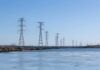 Wind turbines and solar panels in a scenic landscape
