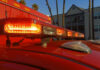 Close-up of emergency vehicle lights on a red ambulance
