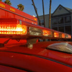 Close-up of emergency vehicle lights on a red ambulance