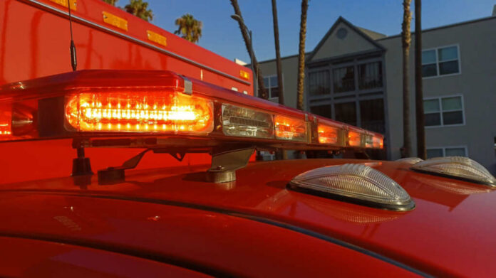 Close-up of emergency vehicle lights on a red ambulance