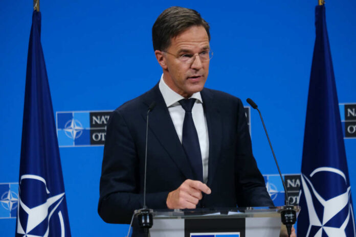 shutterstock2524491697jpg-1 A government official speaking at a NATO press briefing
