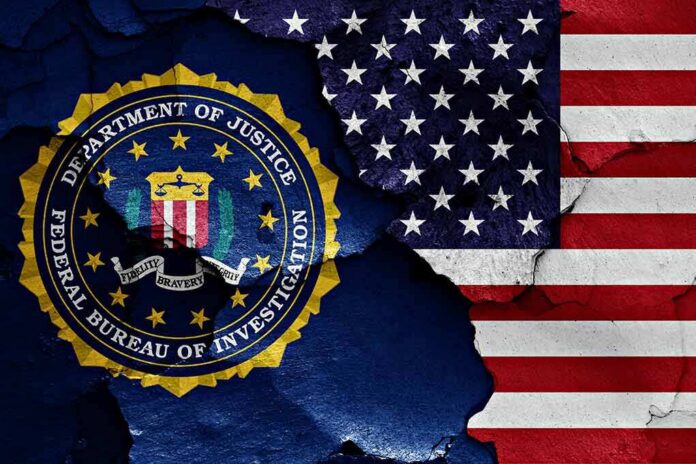 shutterstock_1023380488-3 FBI seal and American flag on cracked wall