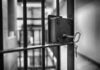 Deadly Prison Riot Kills Twenty-Five Close-up of a jail cell lock with a key hanging