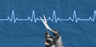 A hand holding scissors above a heartbeat line on a blue background