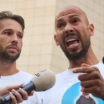 Tate Brothers Arrest Sparks Global Attention Judge with gavel striking sound block