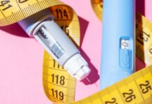 Poison Calls Surge Over Weight-Loss Drug An insulin pen and measuring tape on a pink background