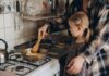 Court Upholds New York Gas Ban Child cooking with adult at a stove
