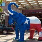 Republicans Hold Huge Fundraising Lead Large elephant statue painted like the Texas flag outside a building entrance