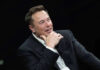Billionaire War Chest Reloads GOP Man in suit smiling, resting chin on hand.