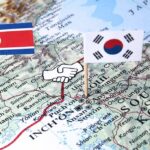 Trump Makes Bold Move On North Korea Map of Korean Peninsula with North and South Korean flags and handshake icon