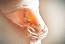 Outside Cash Floods Missouri Abortion War Pregnant belly with illustration of fetus inside