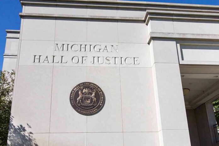 shutterstock_1229690290-1 Michigan Hall of Justice exterior wall with state seal