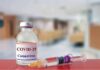 Fauci Diary Reveals Pandemic Power Struggles vaccine vial and syringe on a counter in a clinic