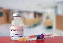Fauci Diary Reveals Pandemic Power Struggles vaccine vial and syringe on a counter in a clinic