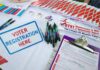 Court Smacks Ohio’s Citizenship Check Voter registration table with forms, pens, and informational materials