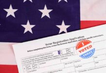 633,000 Arizona Voter Files Hacked Voter registration form with I Voted sticker on American flag