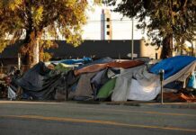LA U-Turn: Camping Back At Iconic Spots Street encampment with tarps and makeshift tents by roadside