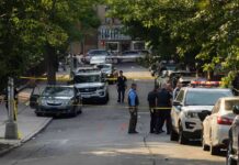 Afternoon Walk Turns Multi‑State Mystery Police officers secure a residential street with patrol cars and yellow tape