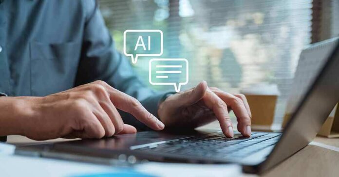 shutterstock_2600992819 Hands typing on a laptop with AI chat icons