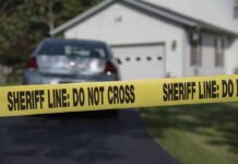Backyard Grave STUNS Quiet Suburb Sheriff line tape blocking a suburban driveway