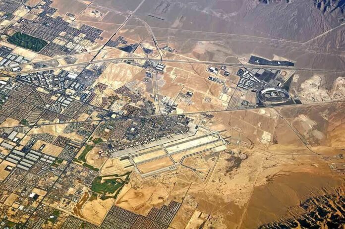 shutterstock_473809174 Aerial view of desert city with airport and highways