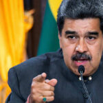 Timing Trick: Maduro Tries To Flip The Script Man speaking passionately and gesturing during a speech.