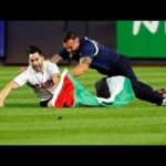 Flag Dash Erupts at Yankee Stadium Man stormed yankee stadium at 9:11 pm with palestinian flag