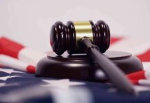 Judge Slams Brakes On Hormones Judge’s gavel on a base over an American flag