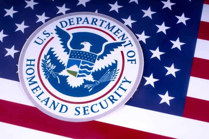 shutterstock_1051372526 U.S. Department of Homeland Security seal on American flag
