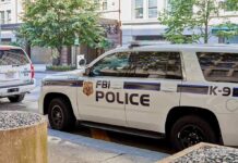 FBI Sting Stops ISIS-Backed Mass Shooting FBI police K-9 SUV parked on a city street