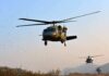 Guard Choppers Trigger Backyard Busts Military helicopters flying low over a dry landscape
