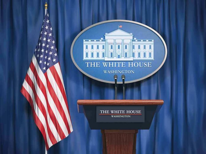 shutterstock_1175844628 White House press briefing podium and US flag