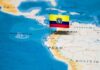 Ecuador flag pin on a map of South America