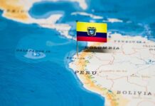 Ecuador flag pin on a map of South America