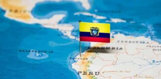 Ecuador flag pin on a map of South America