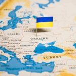 Zelensky Slammed As Pumps Run Dry Ukraine flag pin on a map of Eastern Europe