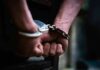 Crime Plunge Turbocharges Trump Attack hands in handcuffs behind back