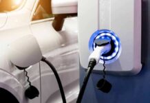 Trump Finalizes Major Fuel Economy Rollback Electric vehicle charging at wall-mounted EV charger