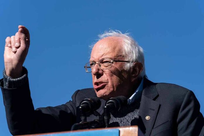 shutterstock_1536112790 Bernie Sanders speaking at a podium outdoors