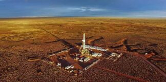 Oil drilling rig at remote desert site
