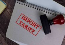 EU’s Bold Canada Play Sparks Trade Alarm Notebook with import tariff stamp and red-handled rubber stamp
