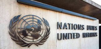 United Nations emblem and signage on a concrete wall
