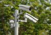 Massive Camera Network Hides in Plain Sight surveillance cameras mounted on a metal pole