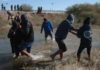 Brain-Eater Strikes After Summer Swim Group of people wading through a shallow river
