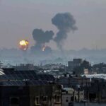 Plan to Empty Gaza Stuns UN Cityscape with distant explosions and rising smoke
