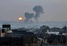 Plan to Empty Gaza Stuns UN Cityscape with distant explosions and rising smoke
